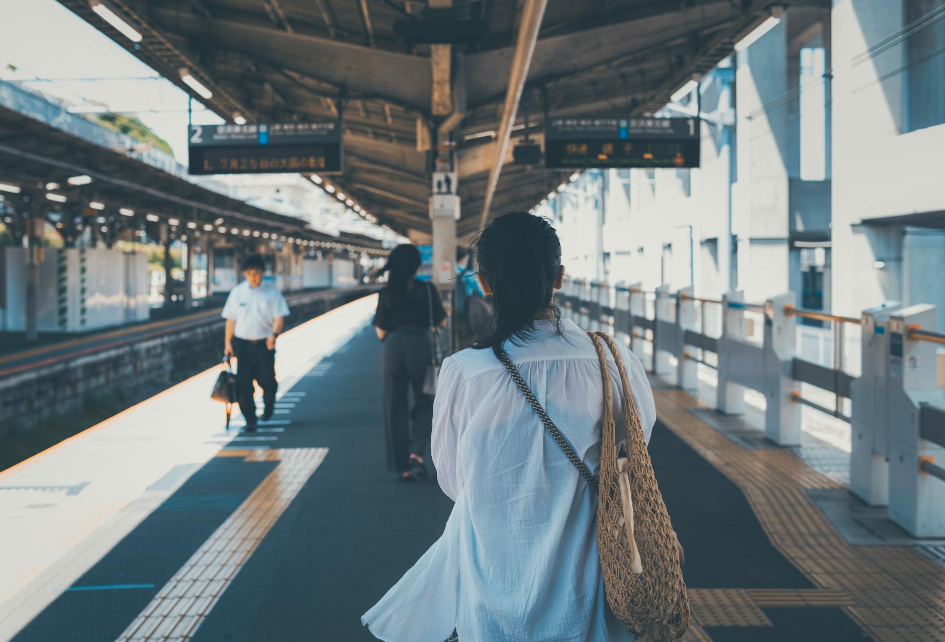 commuters at tokyo train station in daylight